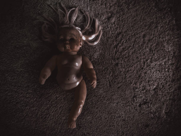 Spooky Doll old child toy scary looking.low light shot