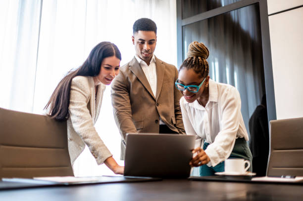 istock Three businesspersons seen in a meeting room during working hours 1475751389