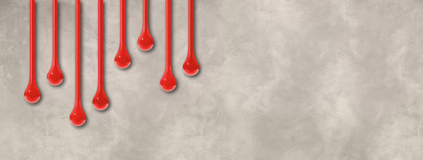 istock Red ink drops on light concrete wall. Horizontal banner 1475754963