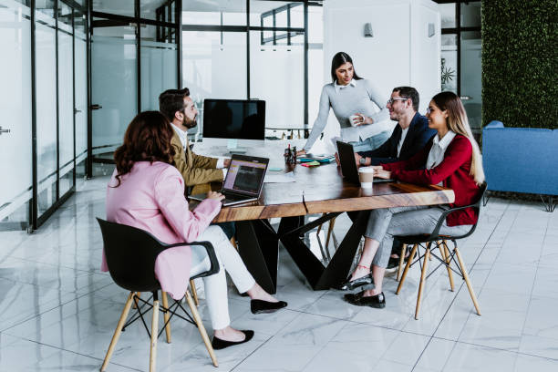 istock group of young hispanic business people or teamwork working in a video call using computer on casual clothes at office in Mexico Latin America 1475758568