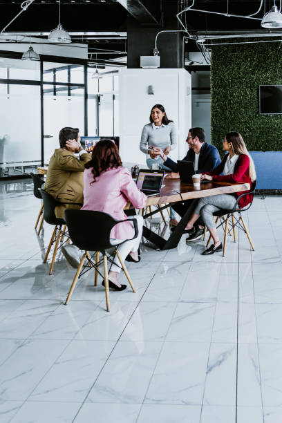 istock group of young hispanic business people or teamwork working in a video call using computer on casual clothes at office in Mexico Latin America 1475758569