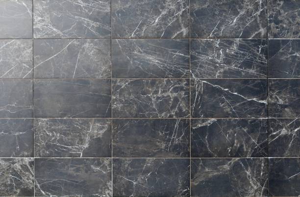 elegante parete piastrellata con marmo nero brunastro con striature bianche. - seamless tile immagine foto e immagini stock