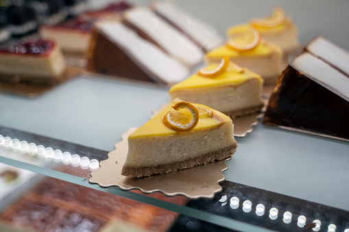 Pieces of delicious homemade lemon cheesecake with slices of lemon