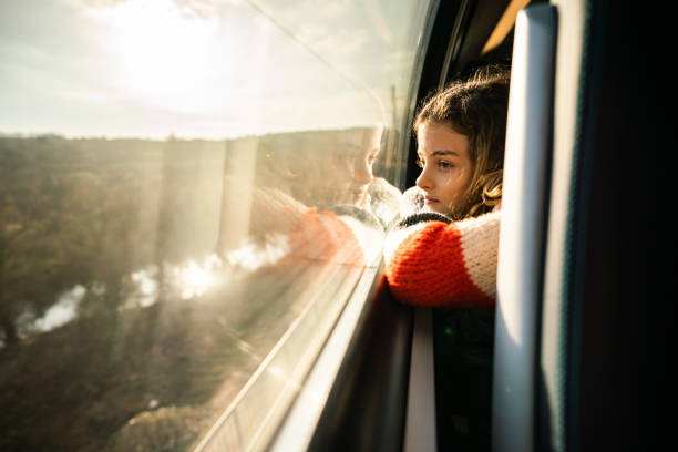 istock Pensive girl travelling on train 1475777566