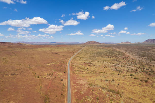 istock Remote road surrounded by dry arid land 1475779888