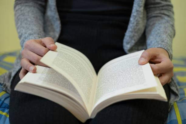 istock Woman reading book in leisure time,knowledge study in lock down,relax lifestyle 1475780048