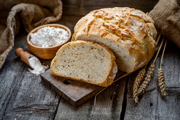 istock Fresh homemade bread on a wooden table 1475780222