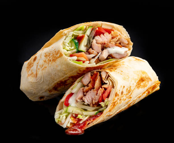 istock Beef shawarma on a dark background. Shawarma with beef in pita bread 1475780237