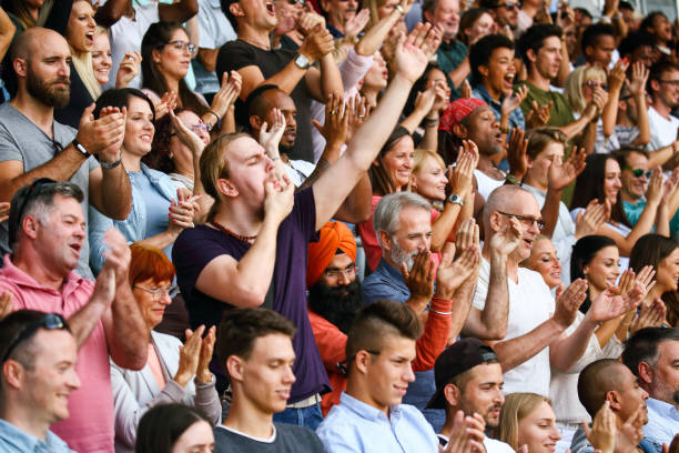 Whistling on fingers at the match