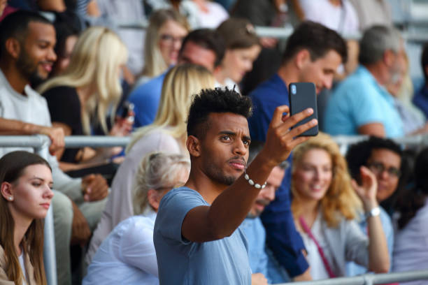 istock Man fan taking a selfie at a footbal match 1475780662