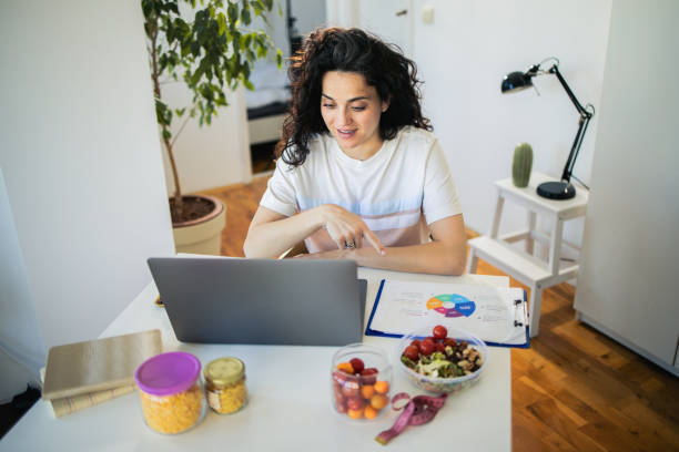 istock Female nutritionist making an online diet plan for her client 1475781658