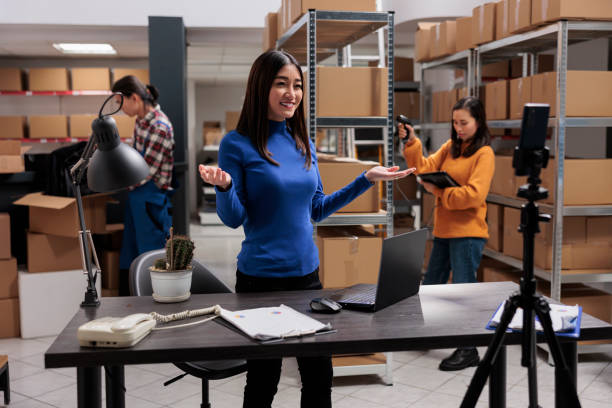 istock Warehouse employee explaining inventory management on smartphone camera 1475784688