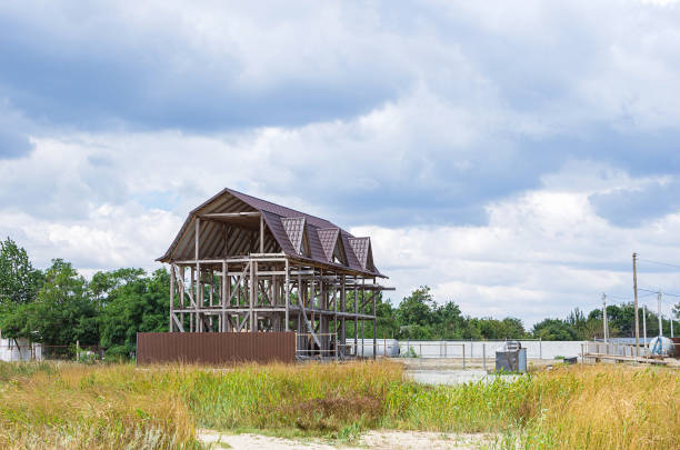 Abandoned unfinished timber frame house.