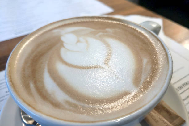 istock On the table in the caf is a cup of fresh cappuccino. 1475788074