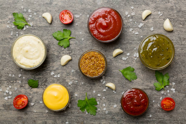 istock Many different sauces and herbs on table, flat lay top view. sauces with spices healthy concept 1475794841