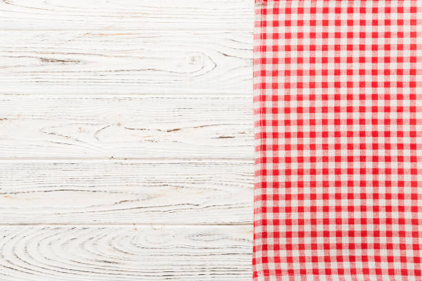 istock top view with red empty kitchen napkin isolated on table background. Folded cloth for mockup with copy space, Flat lay. Minimal style 1475794940