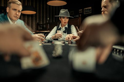 Poker evening for friends in a brown bar