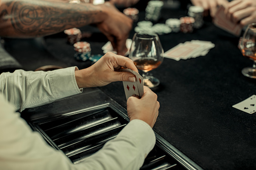 Poker evening for friends in a brown bar