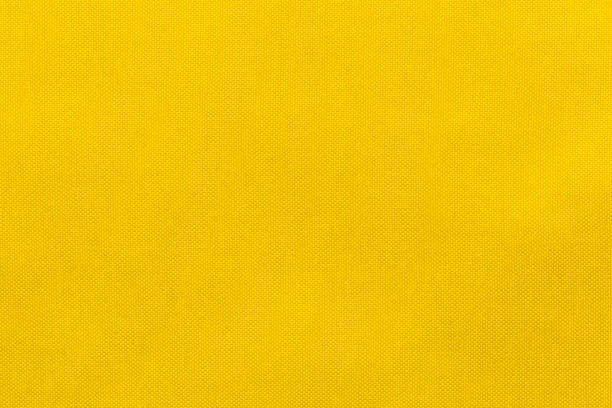 istock Yellow color fabric cloth polyester texture and textile background. 1475797531