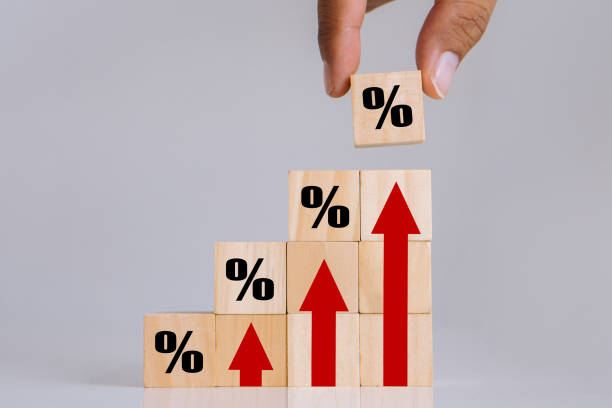 istock INFLATION word on wooden cube with with trading chart.Idea for FED consider, world economics, and inflation control, US dollar inflation. 1475797726