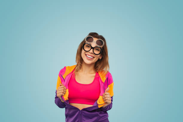 istock Delighted young stylish lady smiling in blue studio 1475800731