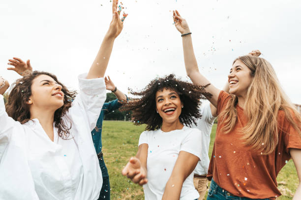 istock Group of mixed ethnicities friends having fun in a park 1475803937
