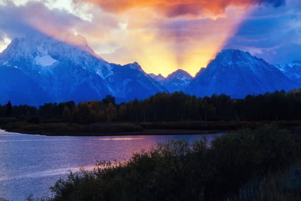 istock Sunset at a mountain landscape by a lake 1475803985