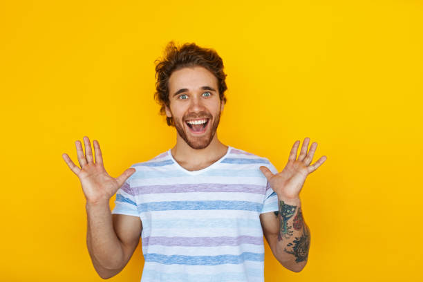 istock Excited young man screaming at camera 1475804228