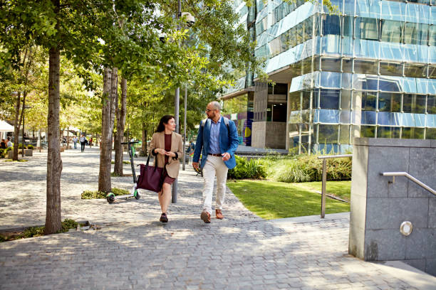 istock Professional colleagues on the move in office park 1475804287