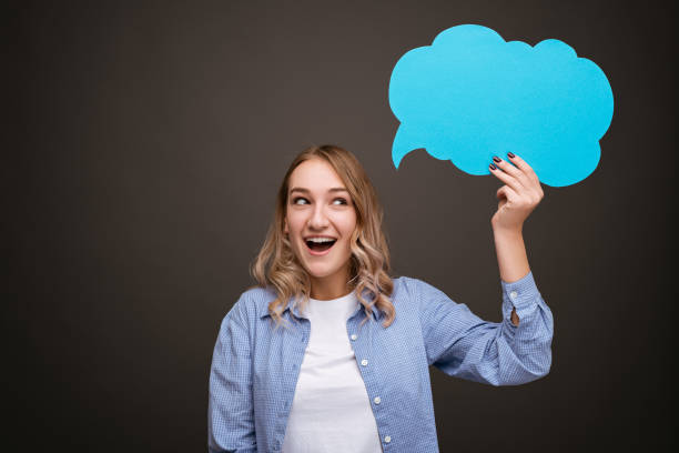 istock Happy female with blank speech bubble 1475804452