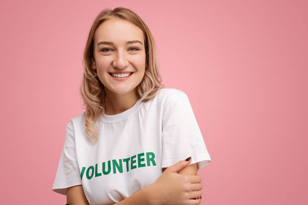 istock Happy young volunteer looking at camera 1475804494