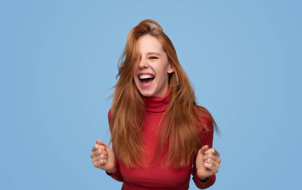 istock Excited young ginger woman screaming 1475805825