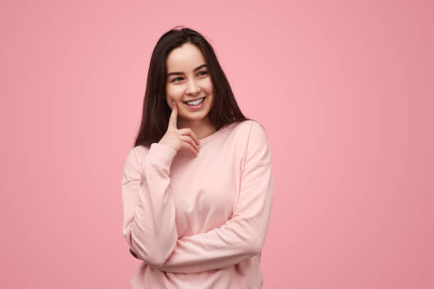 istock Teen brunette smiling and looking away 1475805852