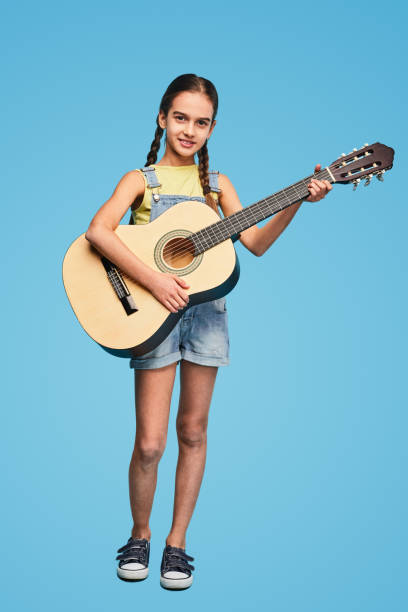 istock Little musician with acoustic guitar 1475808121