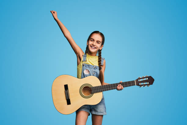 istock Happy little musician with guitar 1475808166