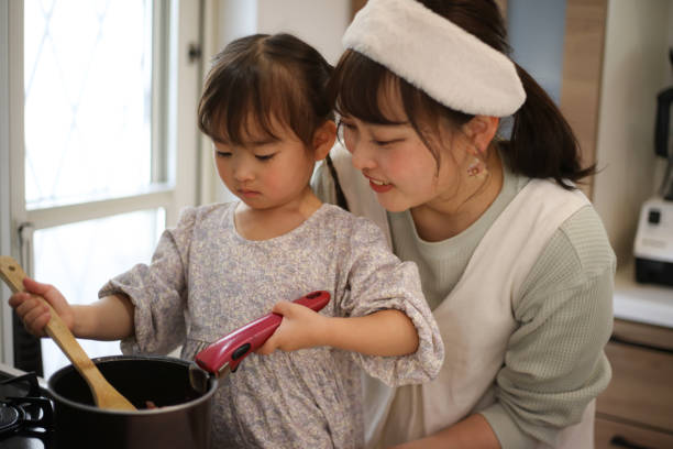 istock parent and child cooking 1475810161