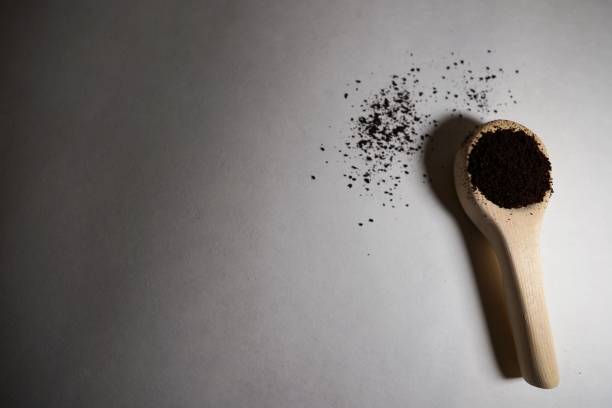 istock Coffee grounds in a homemade wooden spoon 1475810564