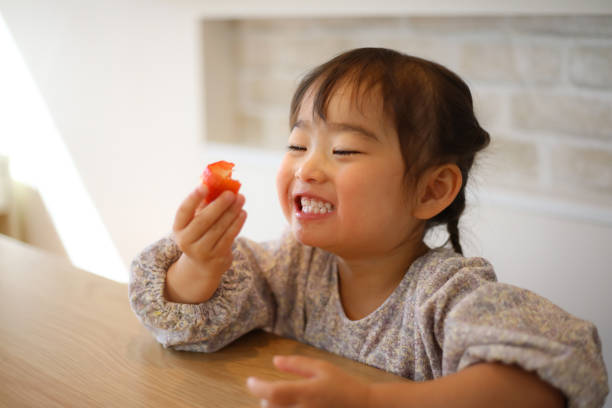 girl eating strawberry