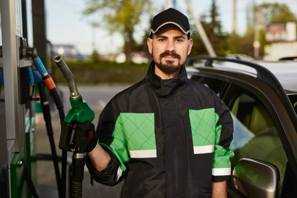 istock Confident worker filling station 1475811368
