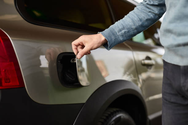istock Crop customer closing gas tank door 1475811438
