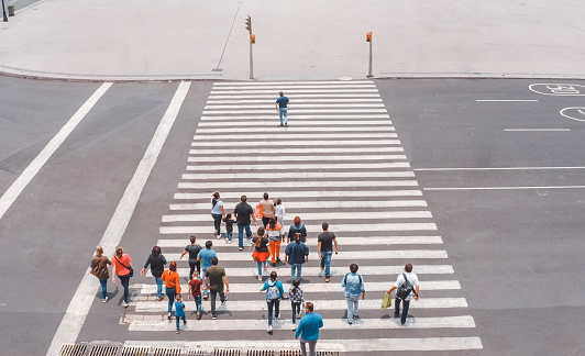 Aerial view of a crowd crossing the street