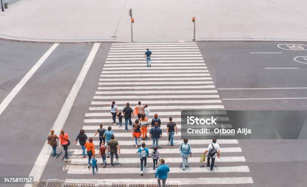 Aerial View Of A Crowd Crossing The Street Stock Photo - Download Image Now - Following - Moving Activity, Social Media Followers, Leadership