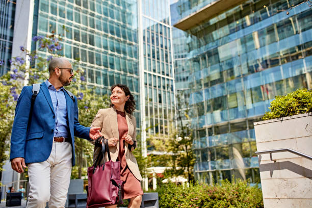 istock Business professionals on the move in downtown district 1475811808