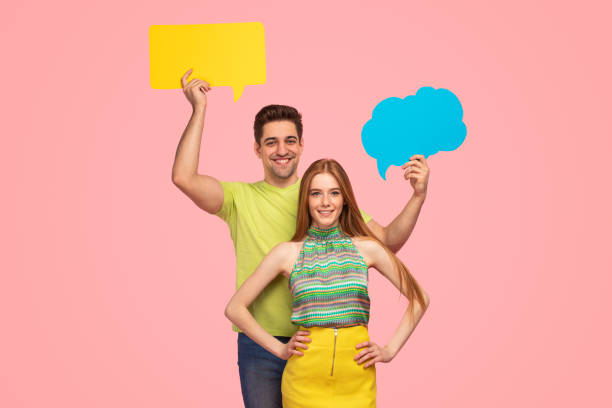 istock Stylish young couple with speech bubbles 1475812953
