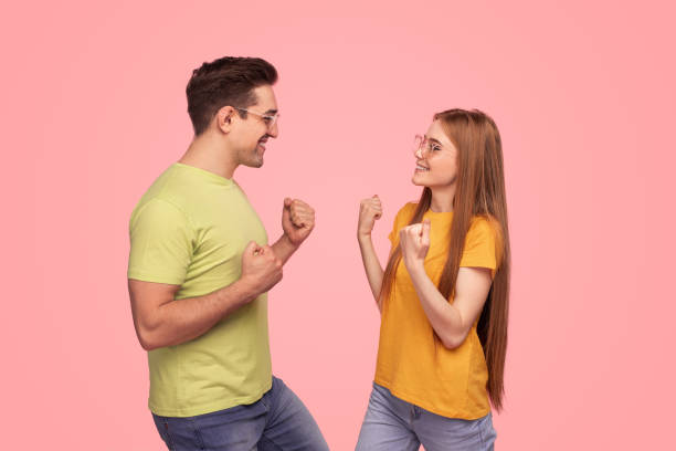 istock Happy couple celebrating victory together 1475812992