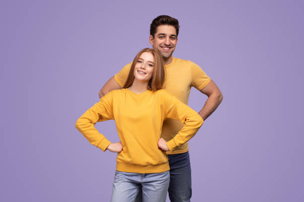istock Happy couple with hands on waist 1475813120