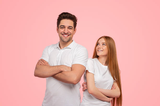 istock Positive young couple with crossed arms 1475813234