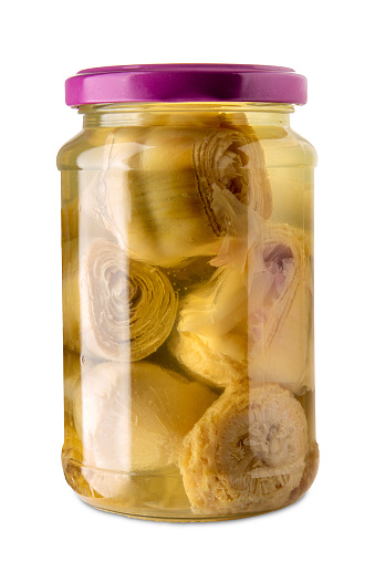 Artichokes in oil in glass jar isolated on white with clipping path included