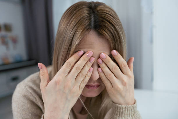istock Pretty brunette woman covering her face with both hands. 1475814212