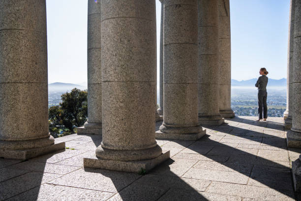 istock Woman looking at a scenic view from a historic monument 1475819408